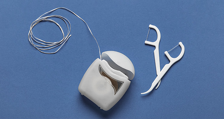 Add dental floss or floss picks to your oral health routine.jpg