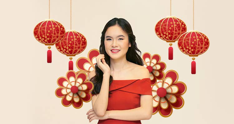Woman wearing fresh makeup for Chinese New Year against a backdrop of lanterns and flowers 
