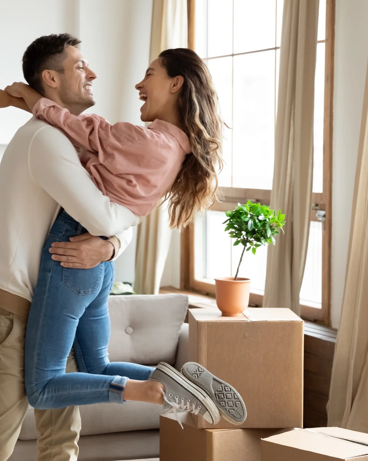 A couple celebrating moving day in their new home