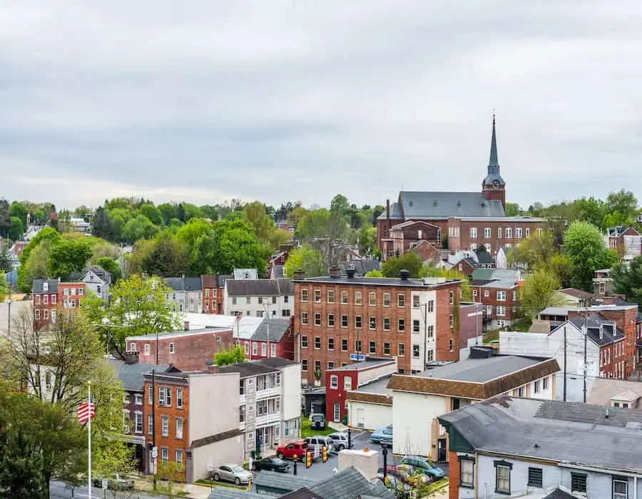 Aerial of historic downtown Lancaster, Pennsylvania with blooming trees