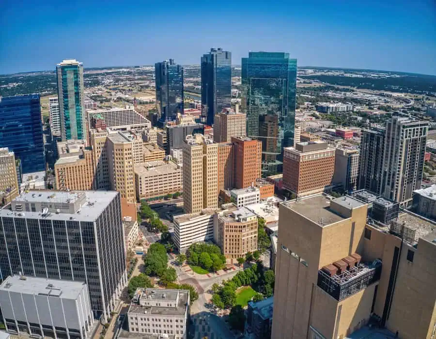 Aerial view of downtown high-rises near Arlington, TX on a clear day.