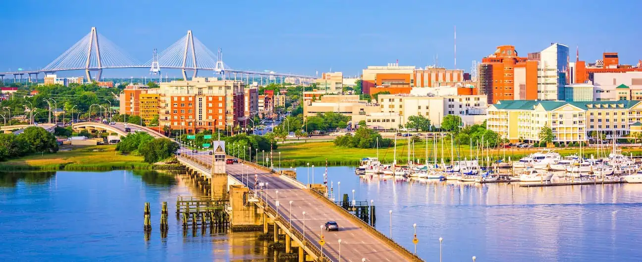 A view of Charleston, SC's skyline, major bridges, and harbor