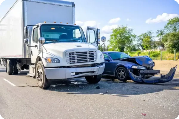 A collision between a moving truck and a car