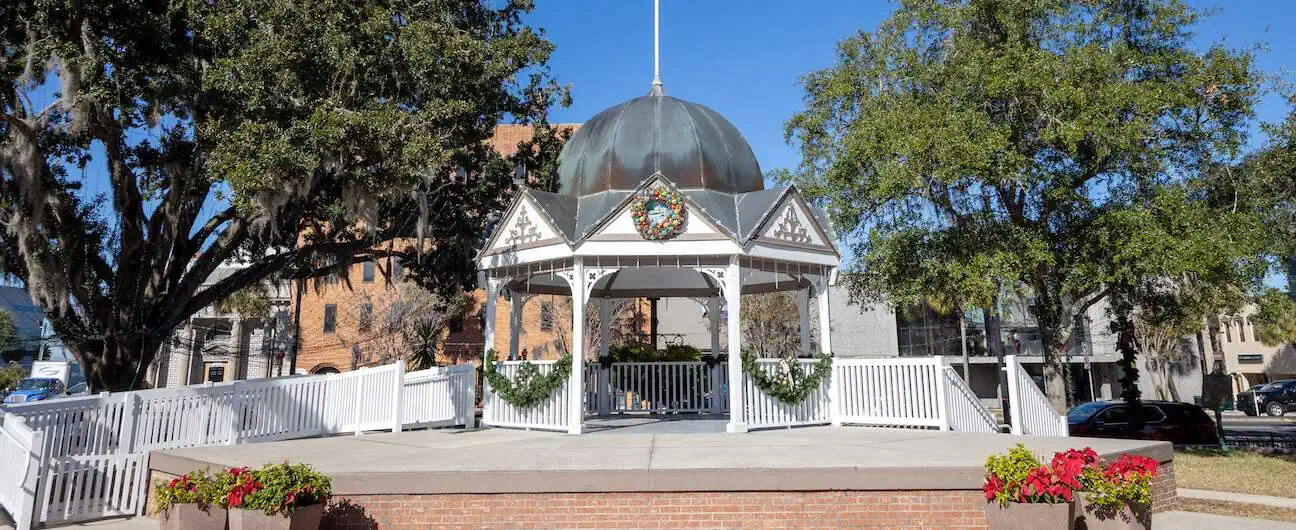 A decorated white gazebo in Ocala, FL's downtown town square