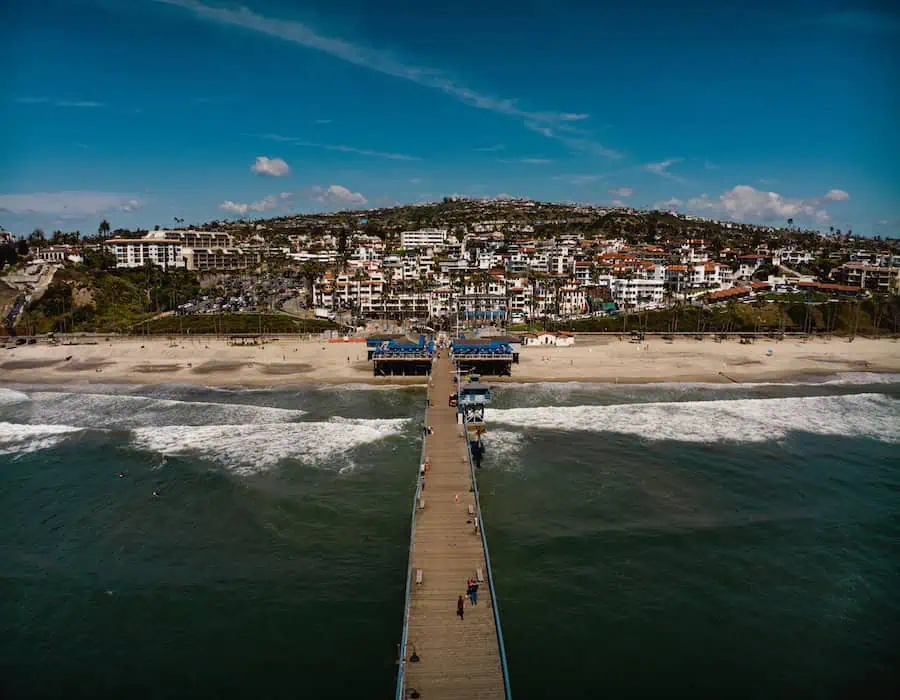 Drone view of San Clemente beach and ocean with pier.