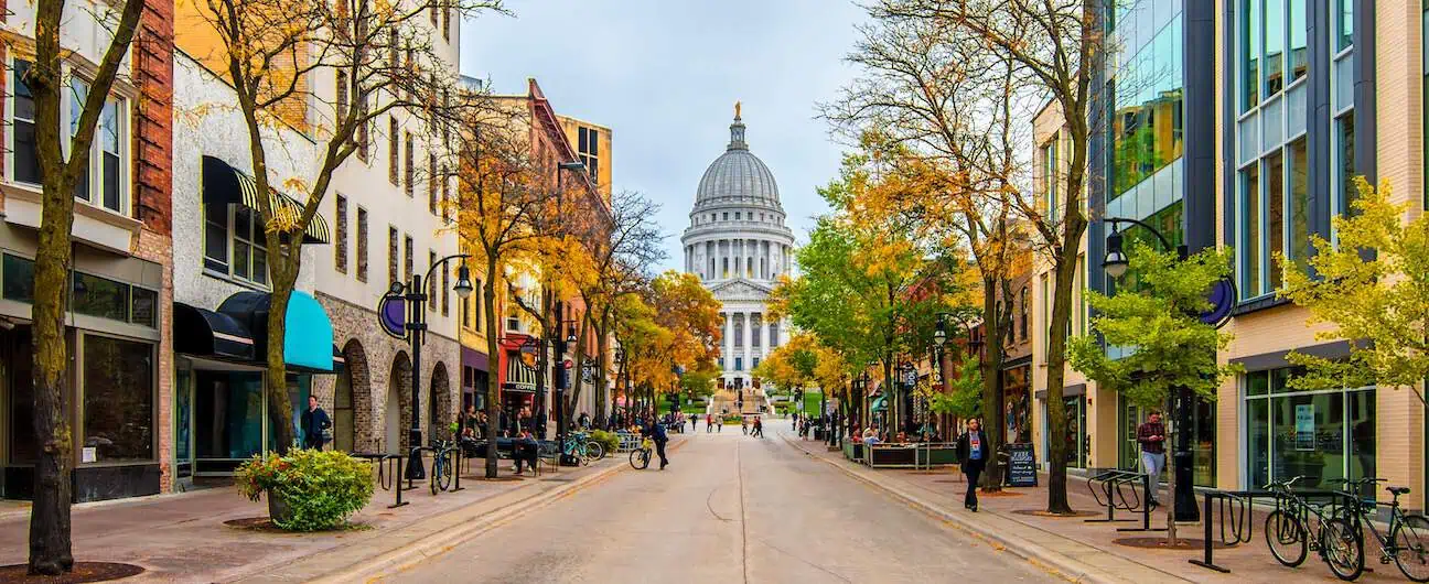 A view of Madison, WI's capitol building at the end of State Street