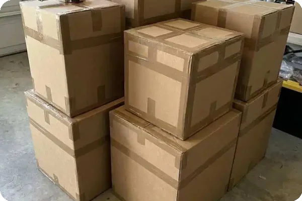 Reinforced cardboard moving boxes piled up