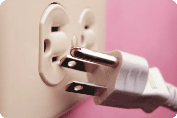 an image of an electrical plug being unplugged