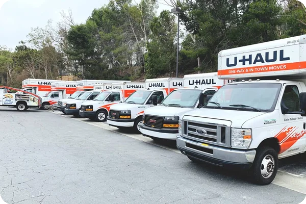 uhaul trucks are all parked and lined up in a row in a lot