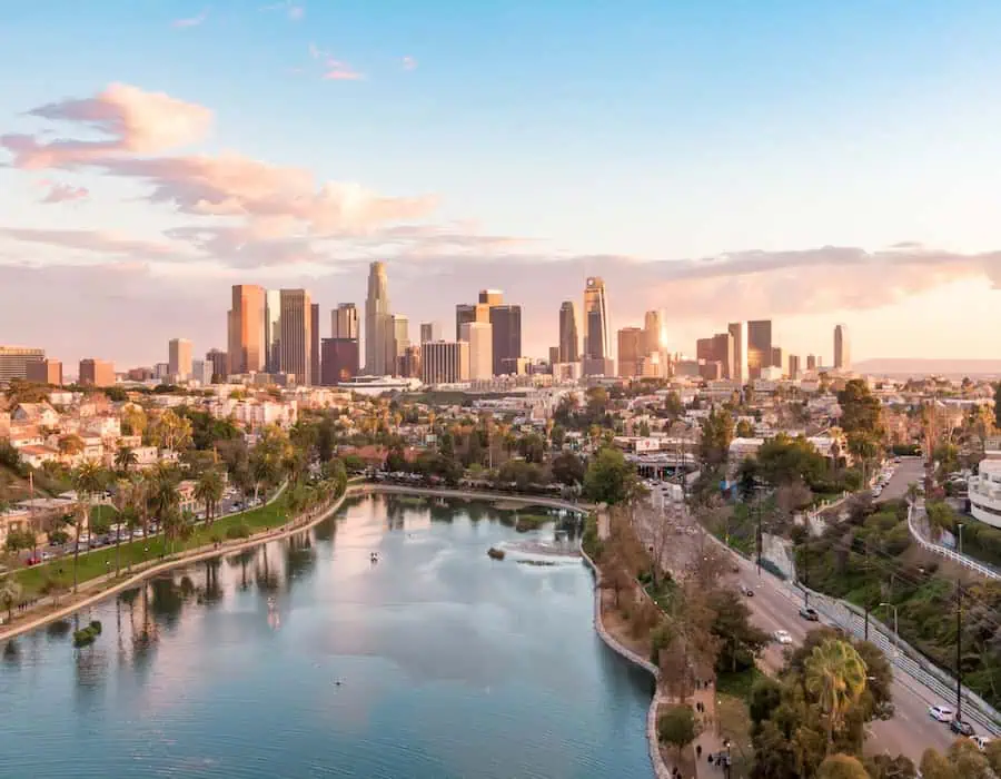 Aerial view of downtown Los Angeles California city skyline and skyscraper buildings during golden hour.