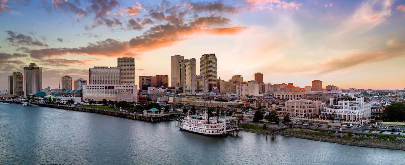 New Orleans River Paddle boat cloudy sky sunset.