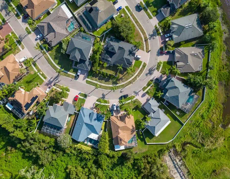 Drone shot of suburban neighborhood in New Port Richey Florida with houses and homes in summer season