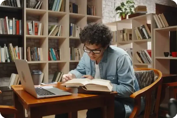Student studying in a library.