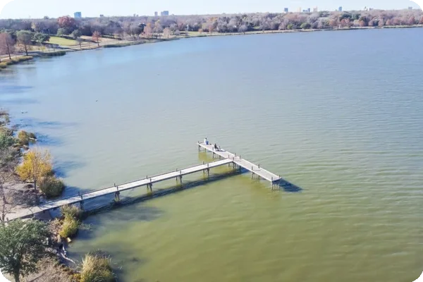 A view of a fishing dock in White Rock Lake, which is near Lake Highlands. The downtown skyline of Dallas can be seen in the distance