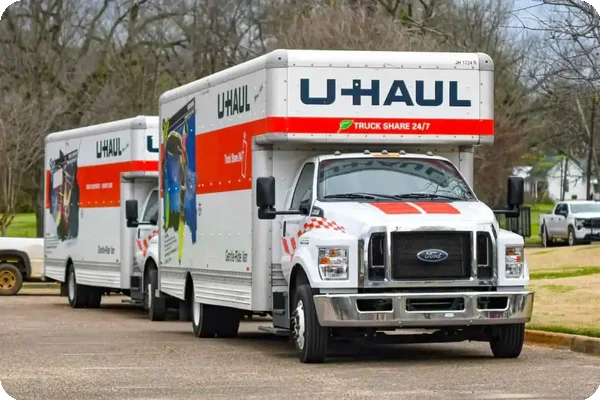 wo U-Haul rental trucks parked