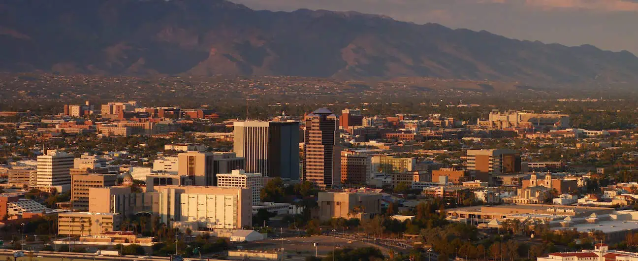 A view of Tucson, AZ's downtown skyline and mountains