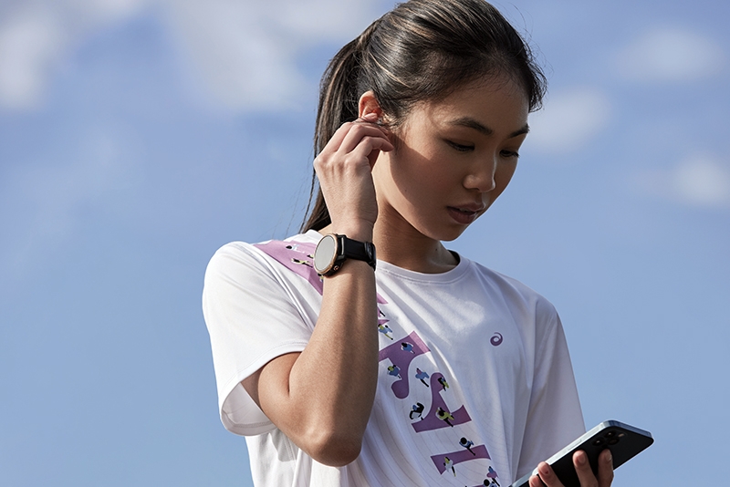 A group of runners running wearing Ekiden sashes