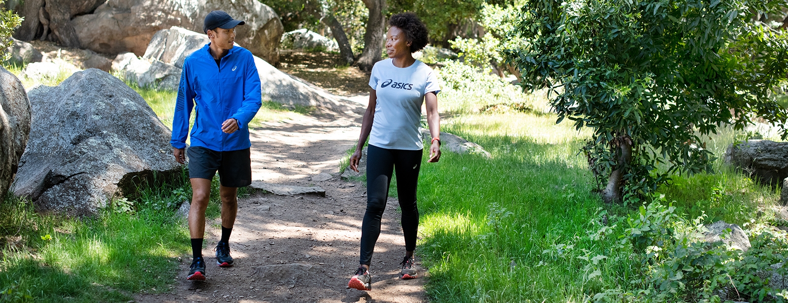 Two people walking outdoors