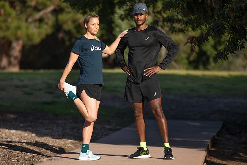 man and woman running with socks on