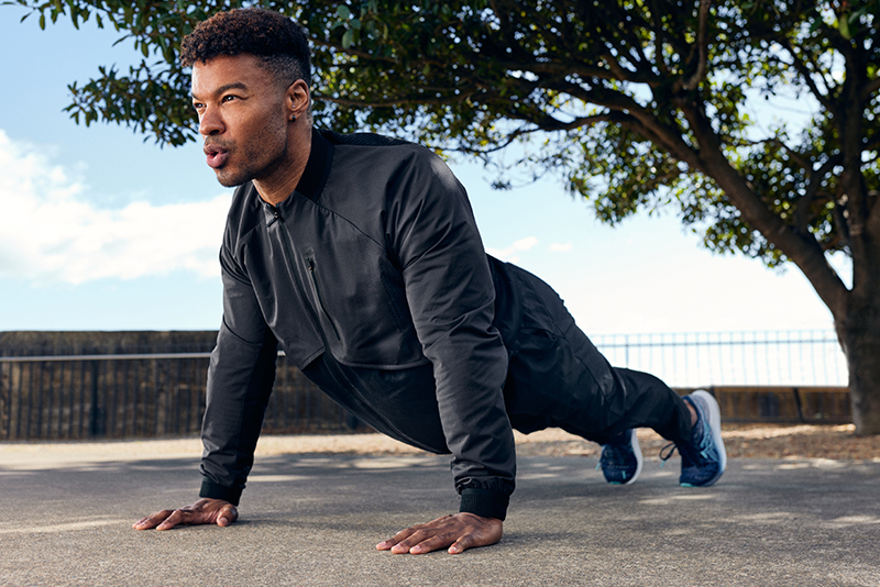 Man doing a plank outside
