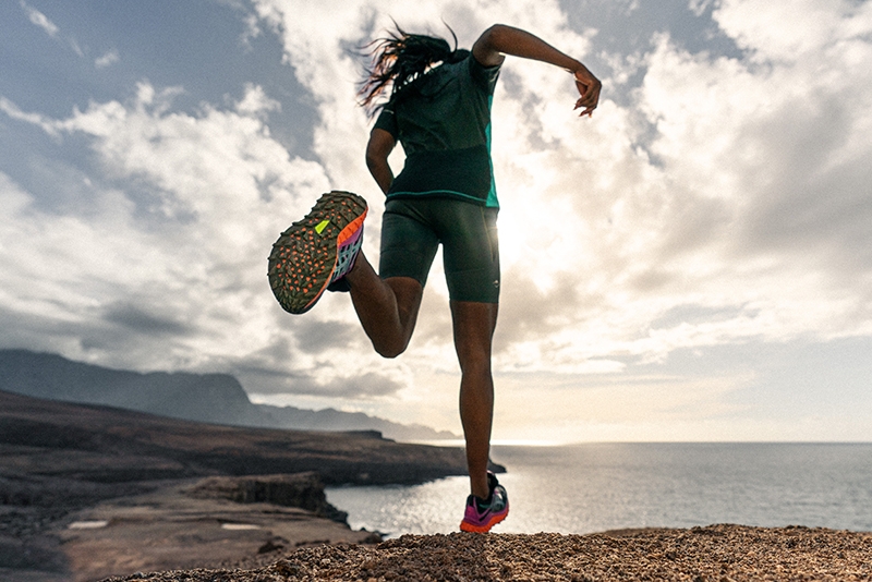 Runner running through water