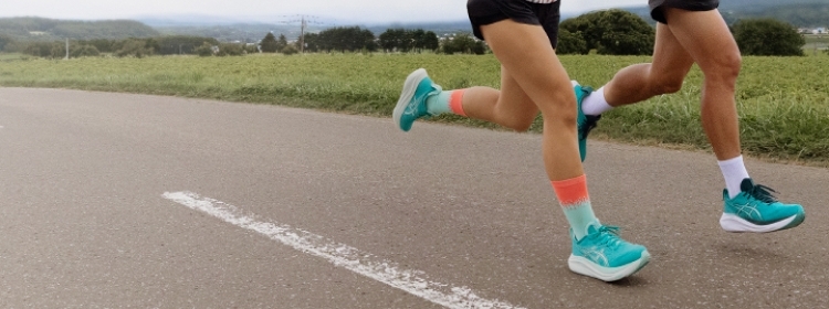ASICS Athletes running while wearing the Gel-Nimbus 27.