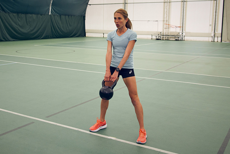 Women using a kettleball