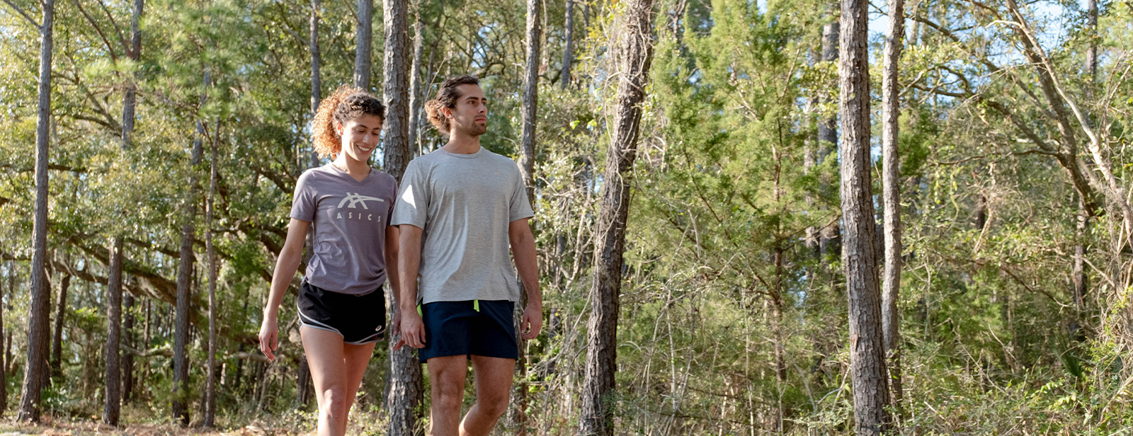 Two people walkinf outdoors