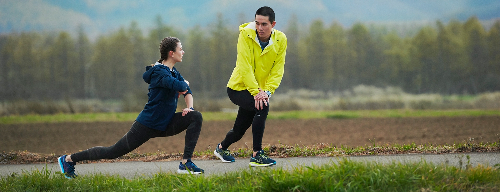 Women and man stretching outside