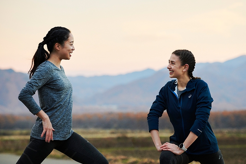 Two friends outside supporting one another