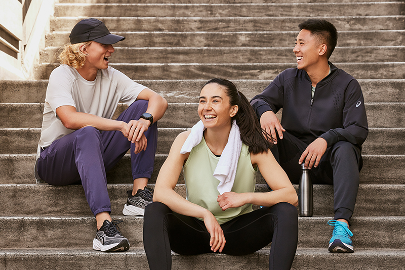 group of people sitting outside on the steps