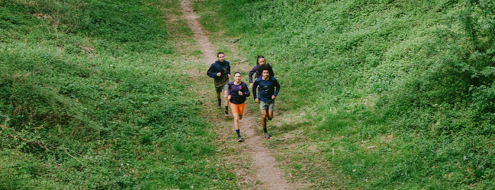 Two people running the trail