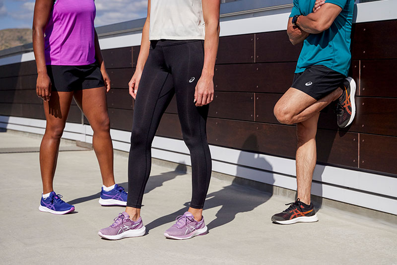 Three people in ASICS shoes
