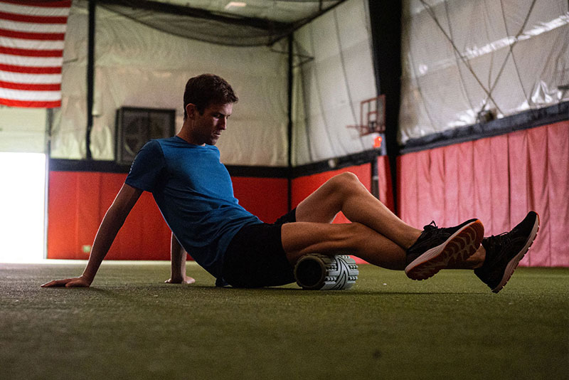 Man foam rolling
