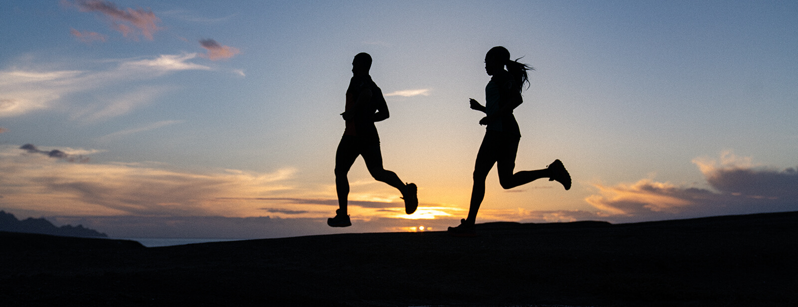 Man and woman jogging in the evening