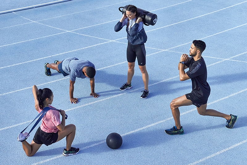 Four people working out in the gym