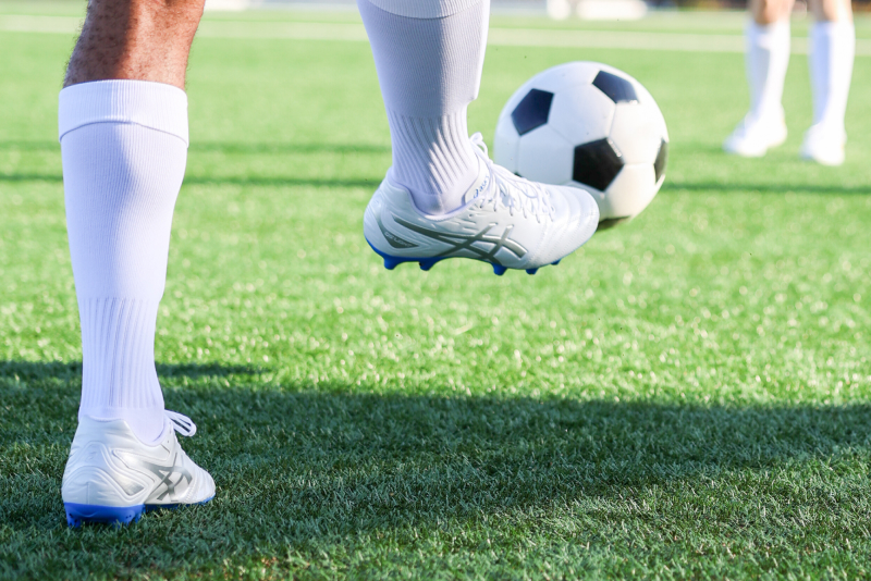 ASICS Athlete playing soccer.