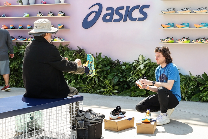 Man trying on ASICS shoes