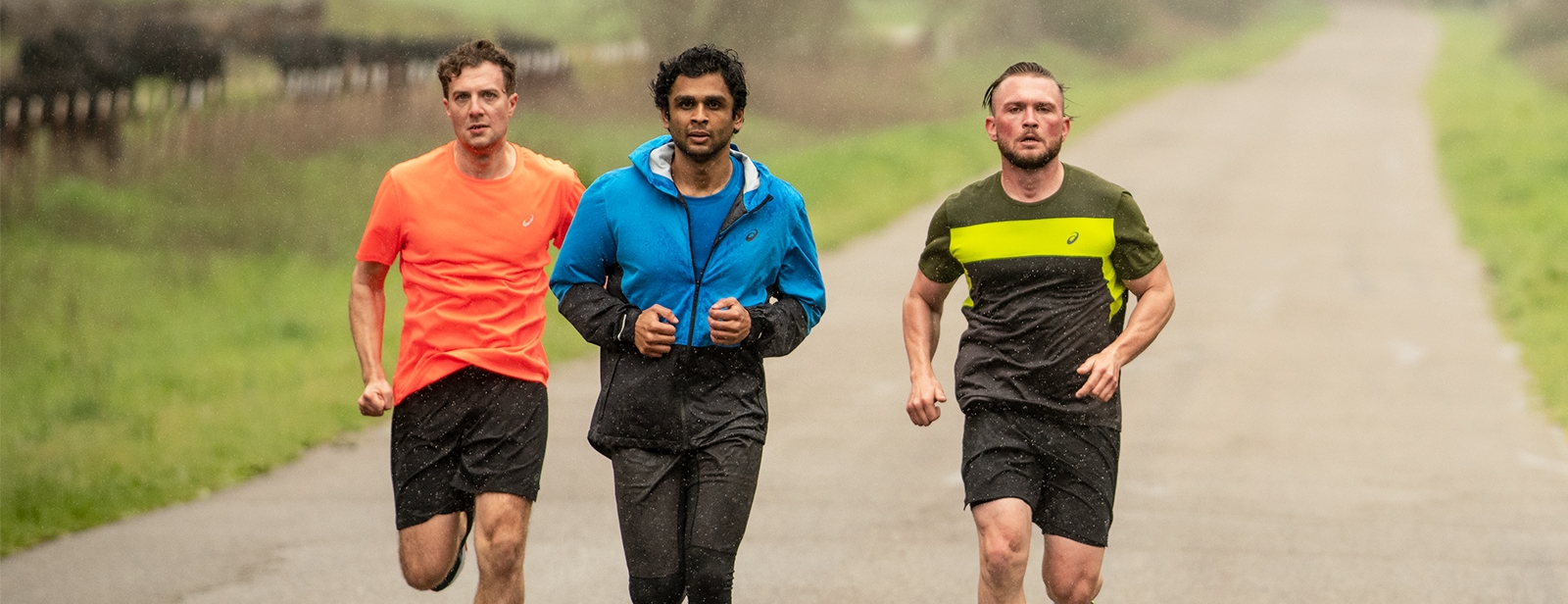 Three men jogging outside