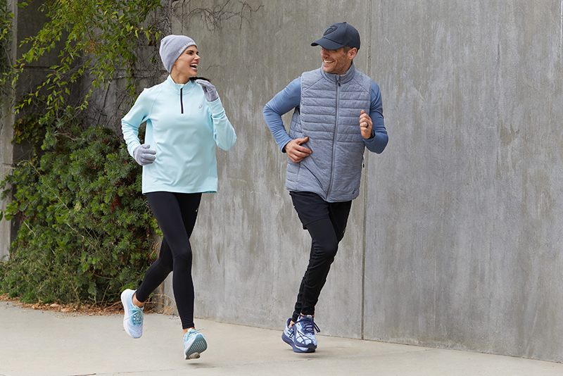 Two people wearing warm running clothes