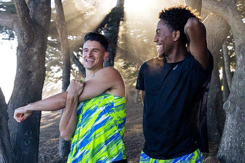 Two people stretching