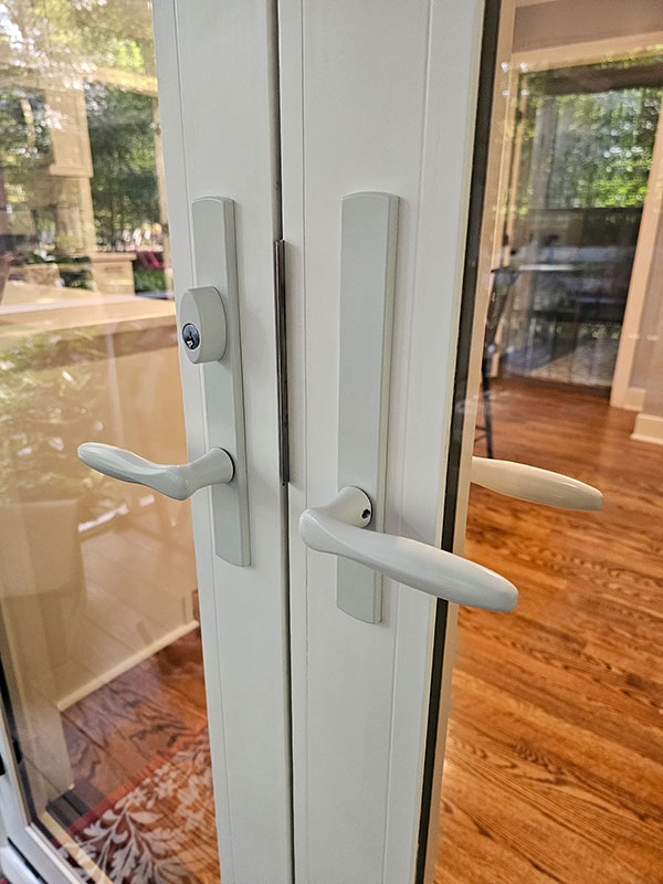 Closeup view of handles and lock on a newly installed French patio door for Midlothian home.