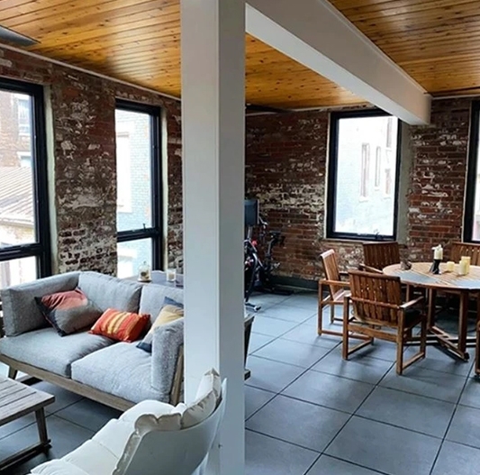 Image of historic Cincinnati townhome patio with newly installed Pella windows.