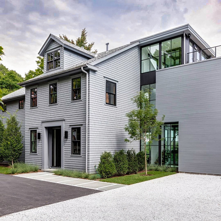 After image of newly remodeled gray house with black windows in Greenwhich.