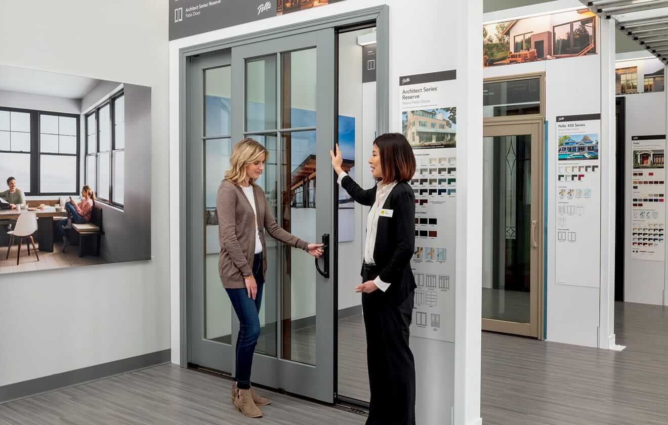 banner image of two women looking at a patio door