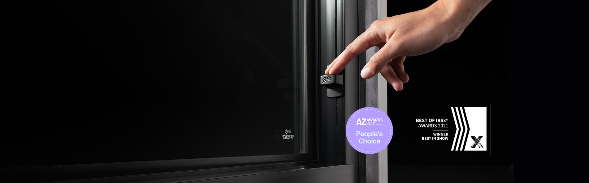 two award icons next to a hand using the easy-slide operator