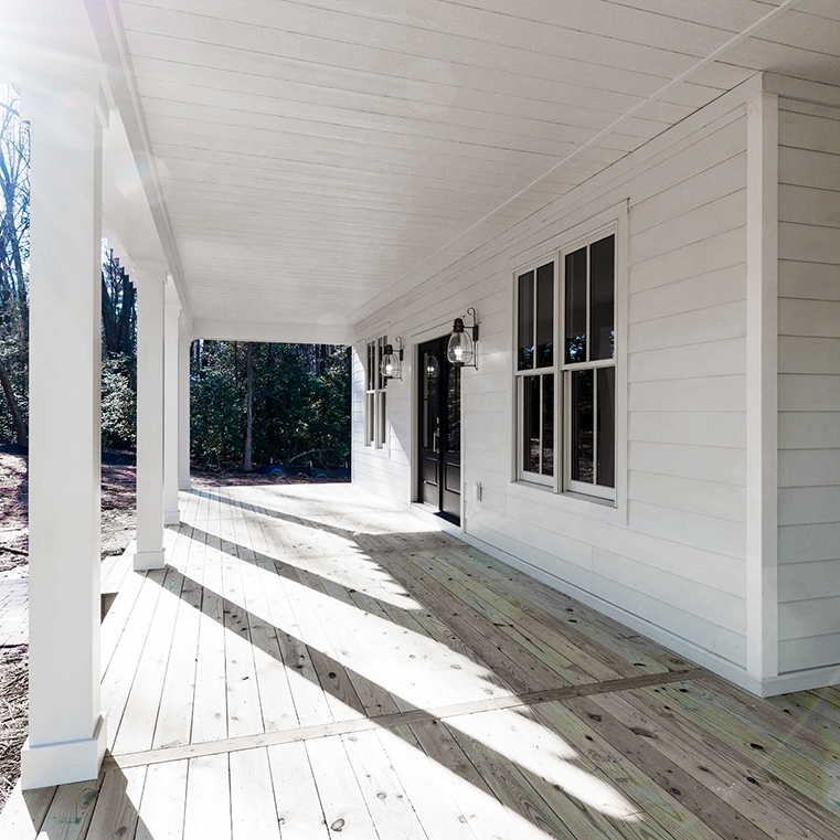 Front porch on Midlothian home highlighting newly installed Pella white windows. 