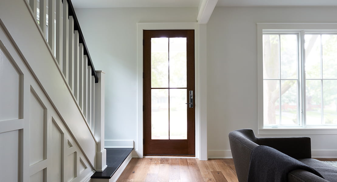 a single full-light reserve wood front hinged door brings a contemporary feel to a classic home