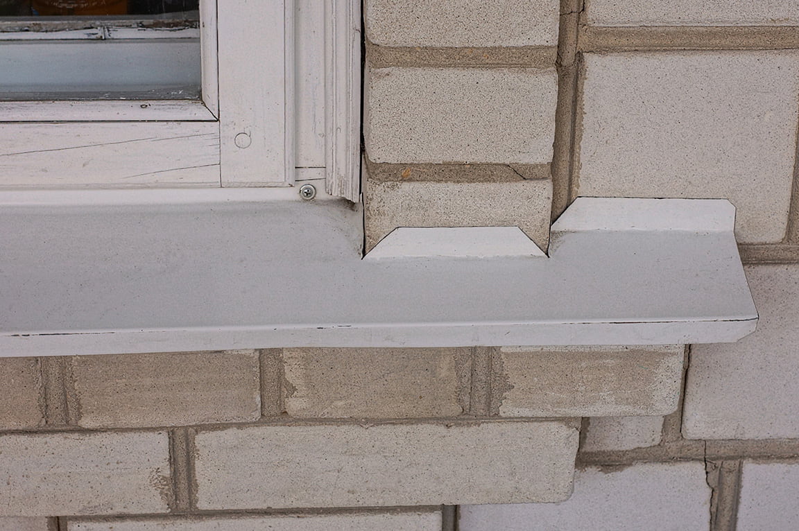 Poorly installed window frame which will cause water to seep inside the frame.