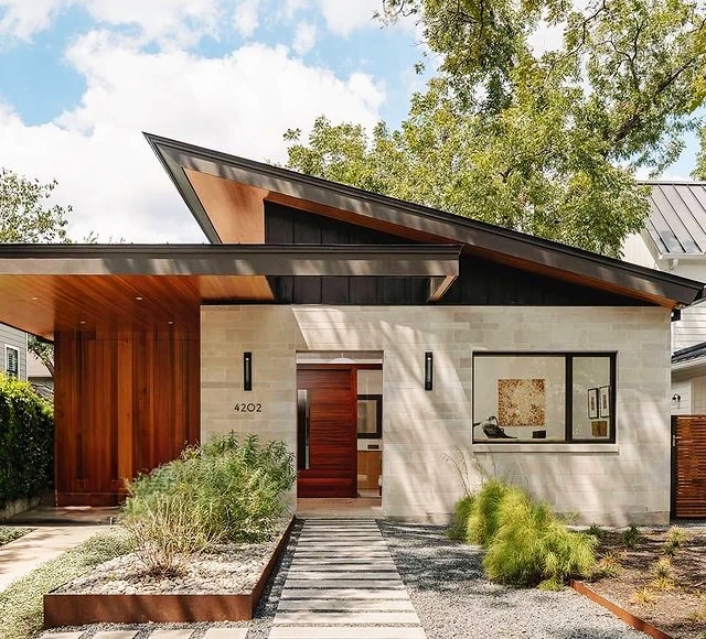 Curbside view of a mid-century modern Austin home with newly installed Pella windows and doors.